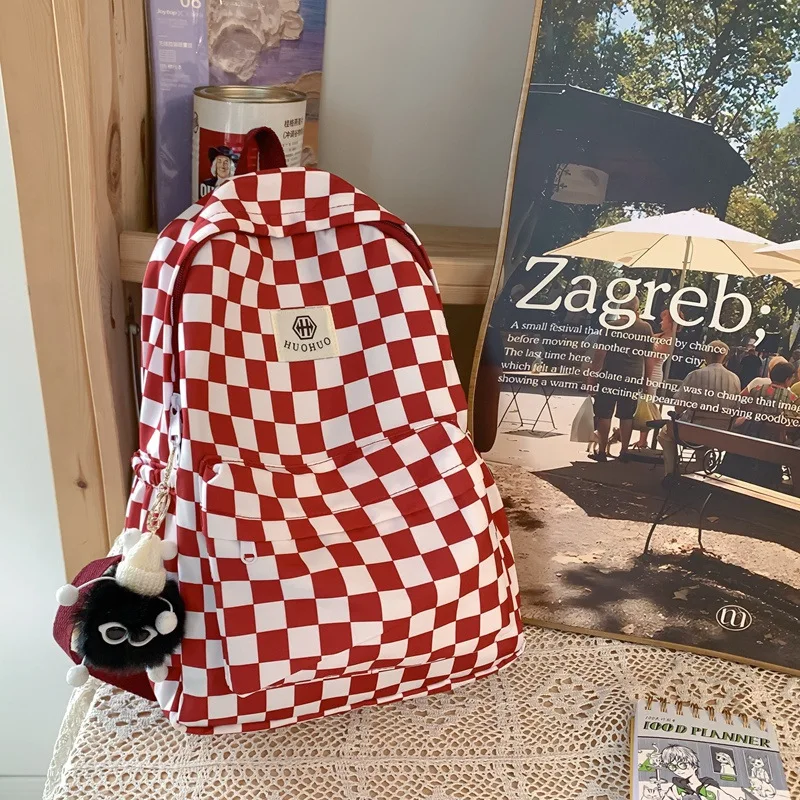 

Korean fashioninsCheckered backpack, casual and versatile, suitable for junior high and high school girls, stylish school bag