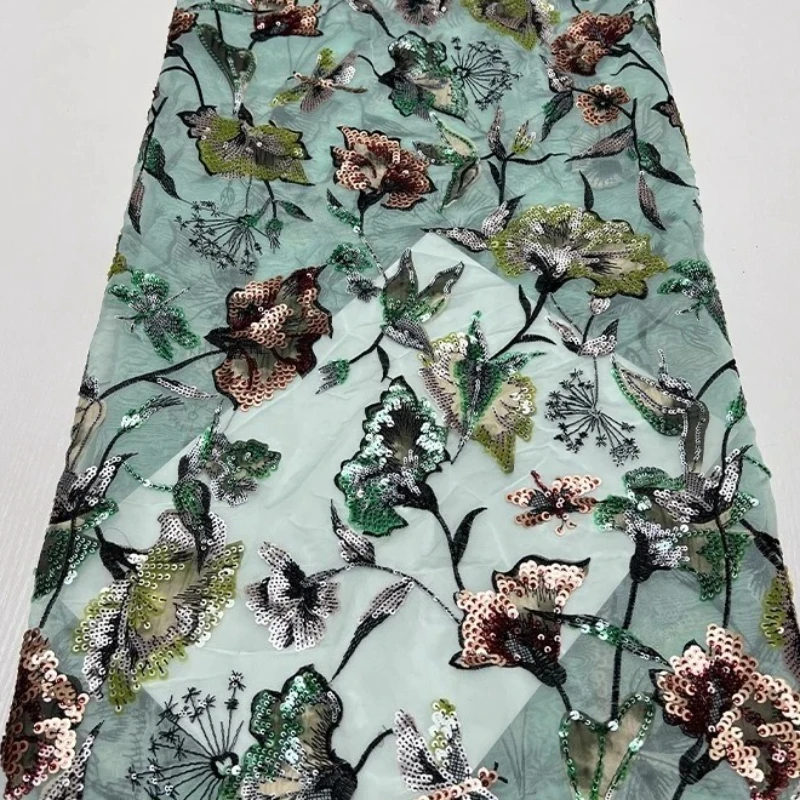 

French luxurious lace mesh fabric and African high-quality beaded sequin embroidered lace fabric are used to sew fabric gowns