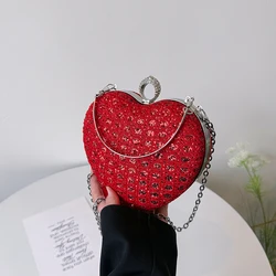 A heart-shaped shiny shoulder bag, bright colors, rich and gorgeous appearance