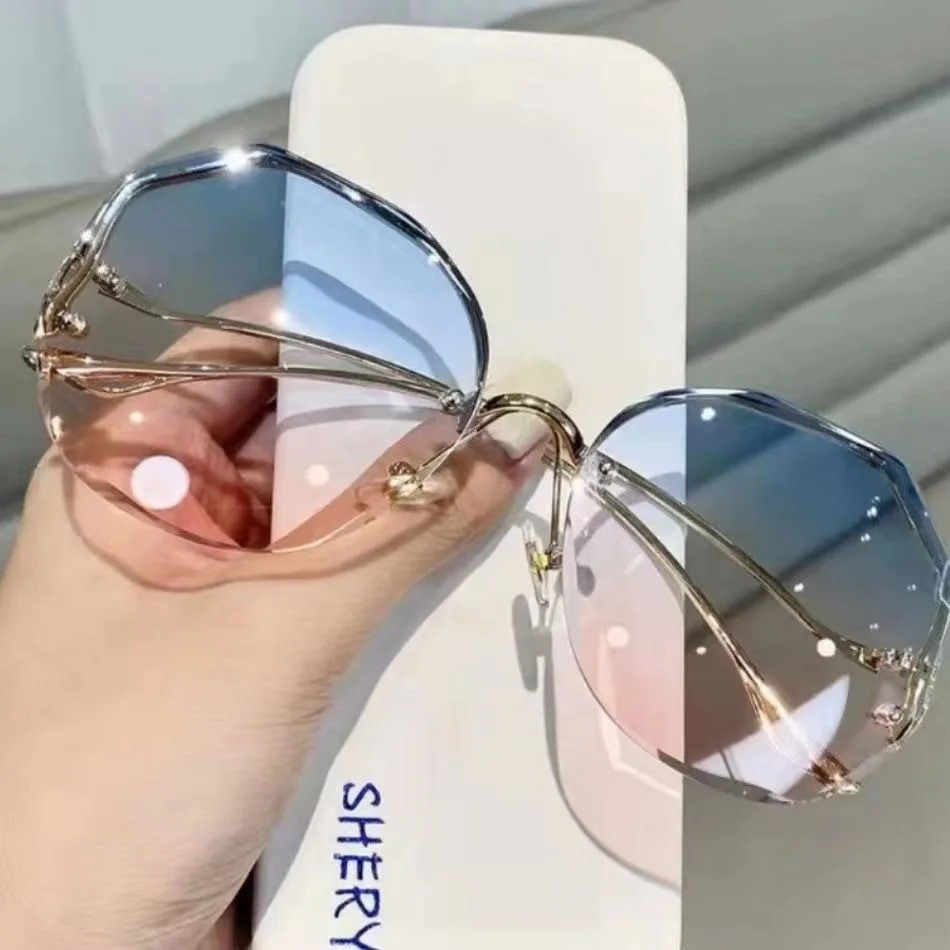 Trendy fashionable polygonal frameless cut edge sunglasses women's metal curved legs retro street photo sunglasses