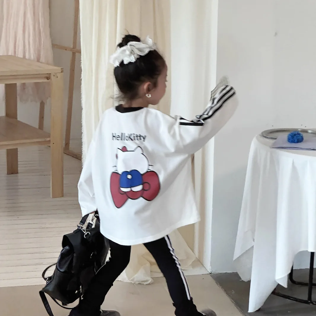 أنيمي HelloKitty الفتيات النسخة الكورية الخريف تي شيرت القوس القط مطبوعة بأكمام طويلة تي شيرت الأطفال ثلاثة بار فضفاض رداء علوي غير رسمي