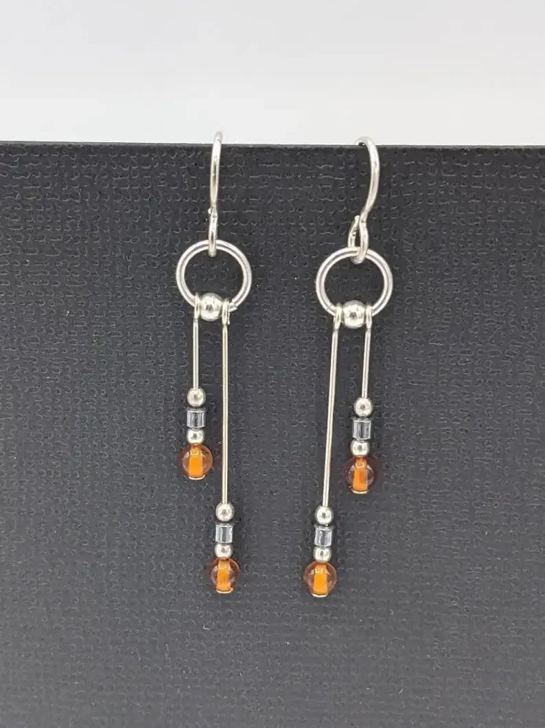 Amber earrings, asymmetric pendant earrings, real amber and hematite earrings