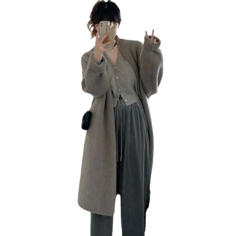 

Features Loose Laid-back Style High-end Design Casual Elegant Look Niche Knitted Cardigan Women Mid-length Sweater Autumn Winter