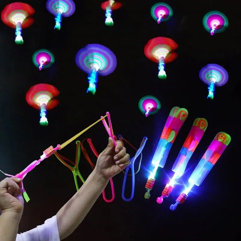 5PCS Outdoor Shining Rocket Flash LED Light Night Kids Luminous Slingshot Toys Shine Slingshot Elastic Helicopter Rotating Toy