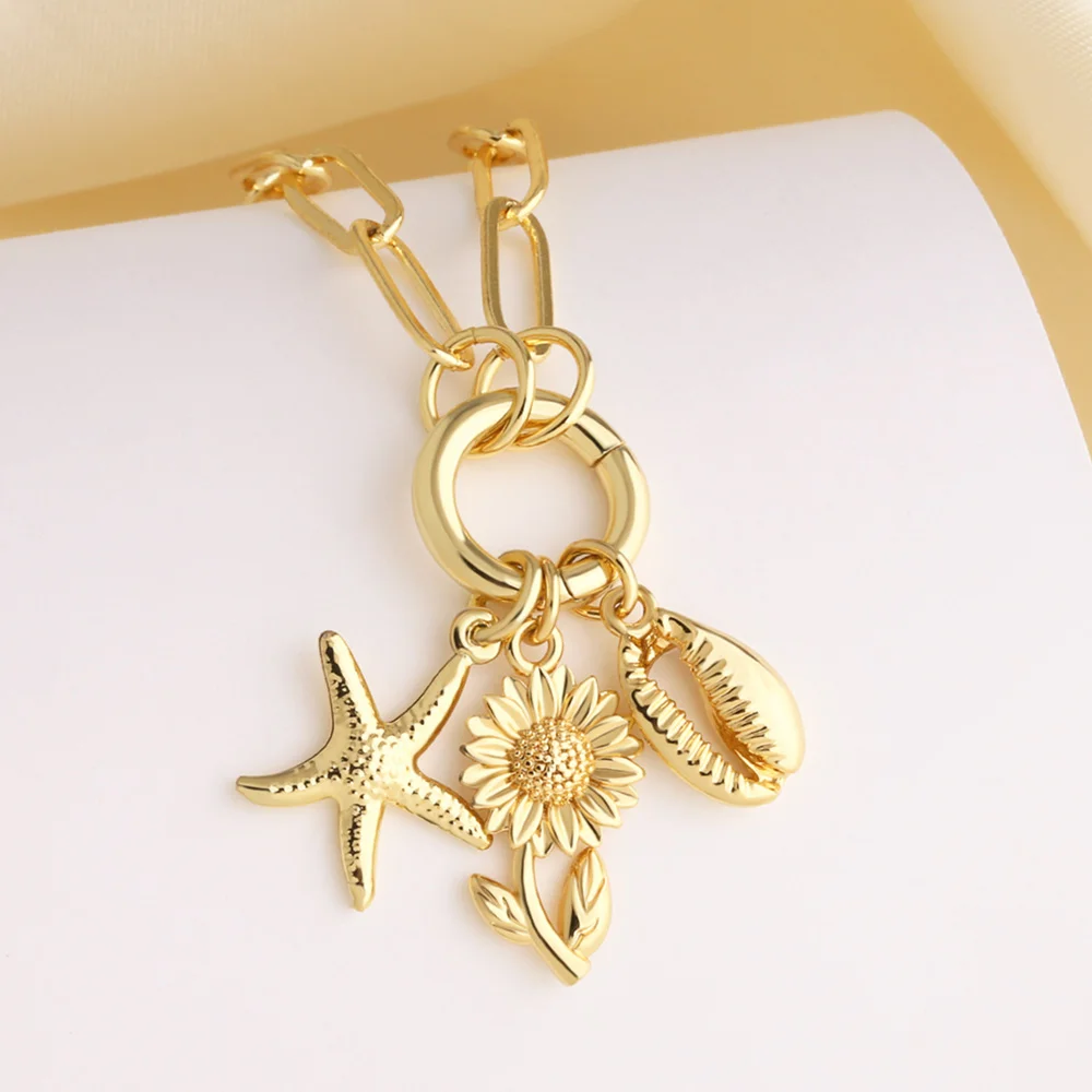 FLOLA Collar de Estrella de Mar y Girasol para Mujer Bañado en Oro 18K Cadena de Clip Dije de Caracol Joyería nkeq13