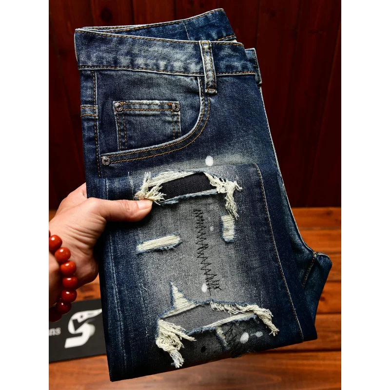 High end nostalgic jeans for men, slim fit with small holes, patches scraped, inkjet street trend, elastic retro denim pants view 3