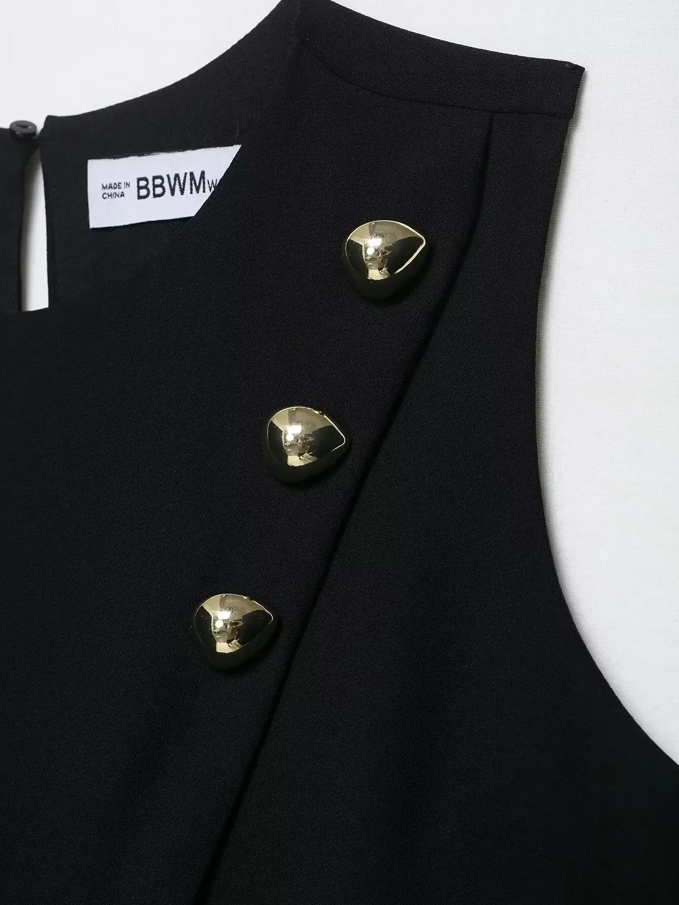 新しいノースリーブ春秋カジュアルベストトップス女性金属ボタン黒ベストトップファッション非対称スリムフィットベスト