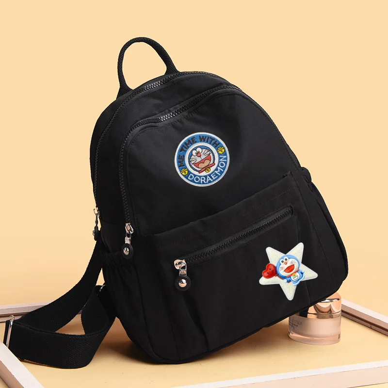 

Doraemon Backpack Women's New Backpack Fashion Travel Handbag Light Oxford Cloth Versatile men Schoolbag Jingle Cat shoulder bag