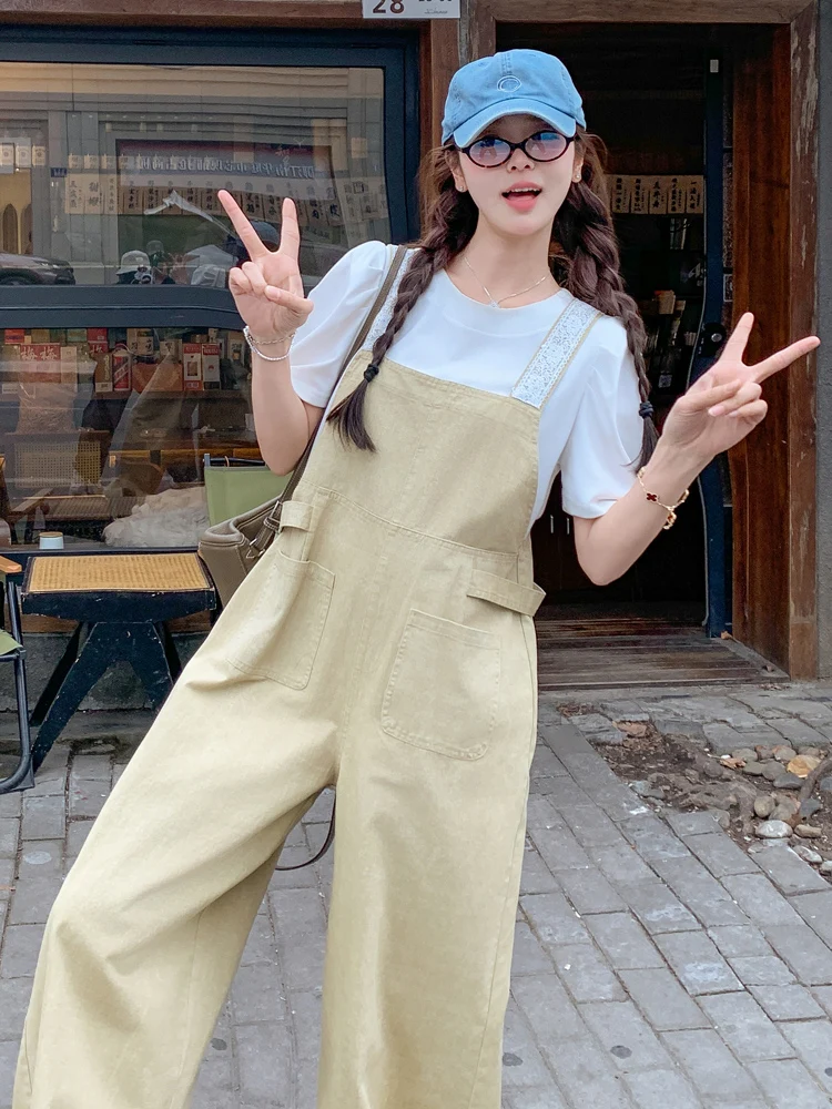 จั๊มสูททำงานสีกากี แต่งขอบลูกไม้ สไตล์ลำลองสำหรับผู้หญิง ฤดูร้อน หวานซ่อนเปรี้ยว ดูอ่อนเยาว์ กางเกงขายาวเอวสูงทรงขากว้าง