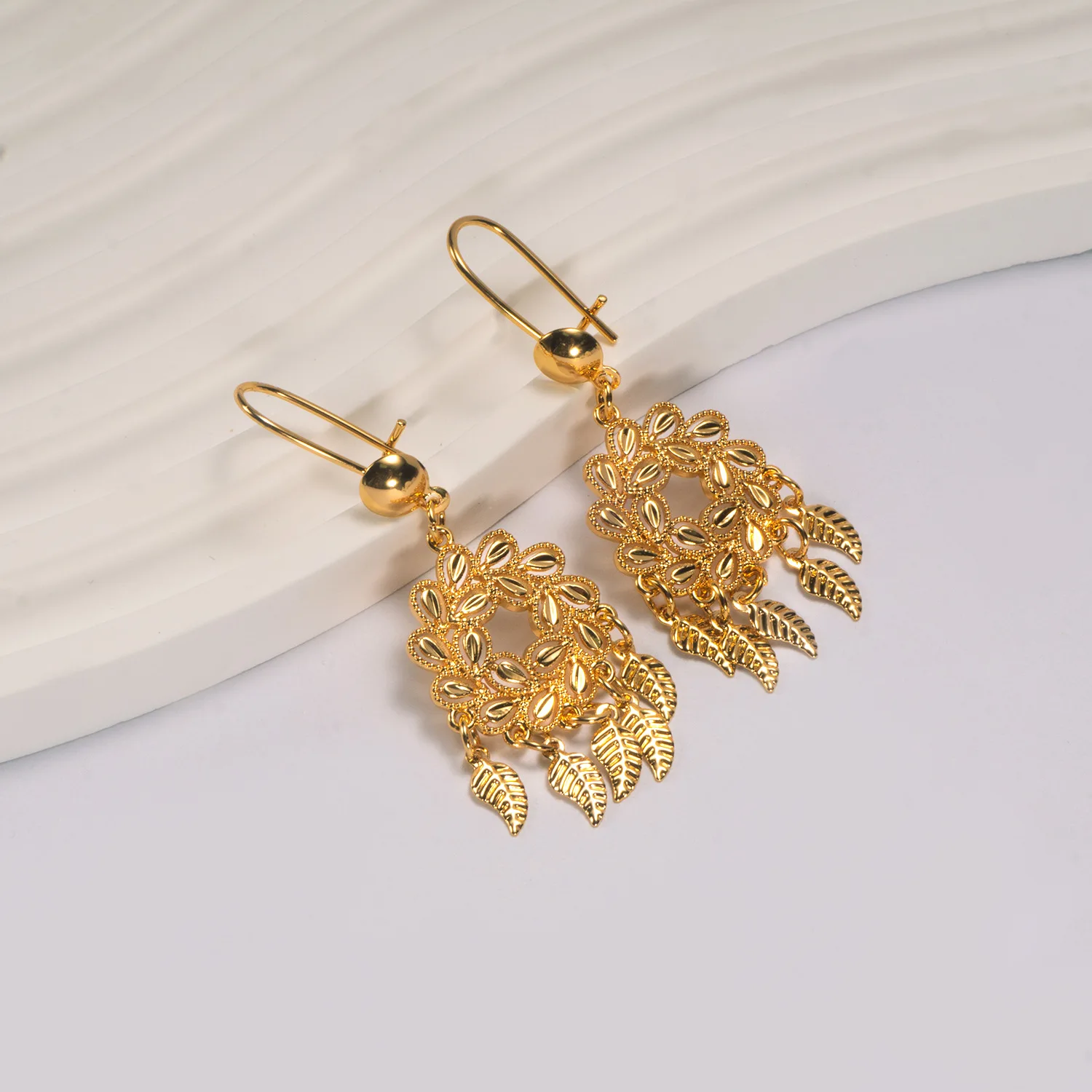9999 gold Feng peacock earrings, European-style fringed bell earrings, Bohemian leaf pendant, scenic area, earrings