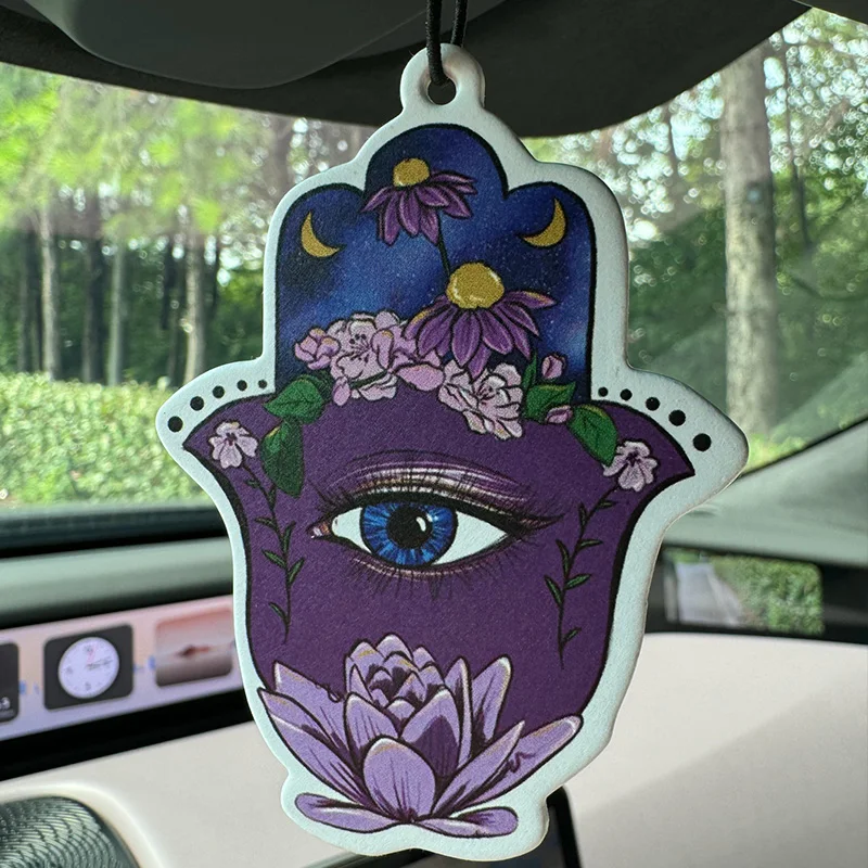 Abstract Hamsa Eye Hilton (Hotel Scent) Car Air Freshener |   Rearview Mirror Hanger & Dual-Purpose Air Vent Clip |   Natural Material Aromatherapy Tablets |   Long-Lasting Fragrance for 90 Days |   Alcohol-Free |   Not Afraid of Direct Exposure to the Sun |   Designed Specifically for Odor Removal in Cars, Closets, and Bathrooms. |   Cartoon Animation Graphics |   Unisex |   Luxury-Grade Fragrance