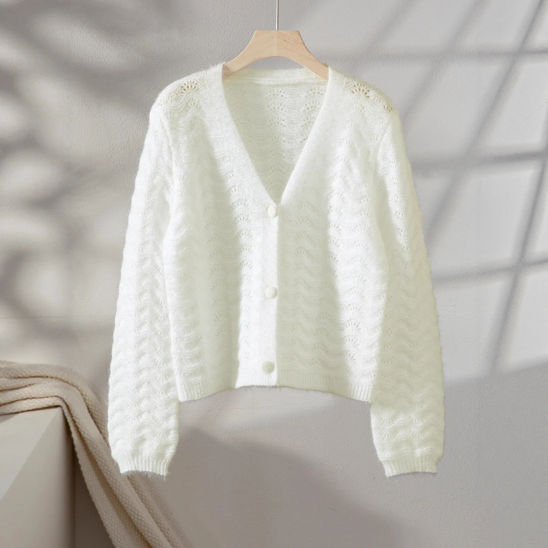 Maglione lavorato a maglia con scollo a V a maniche lunghe scavato sexy Design a vita ampia Nuovo stile Moda femminile Stile europeo e americano