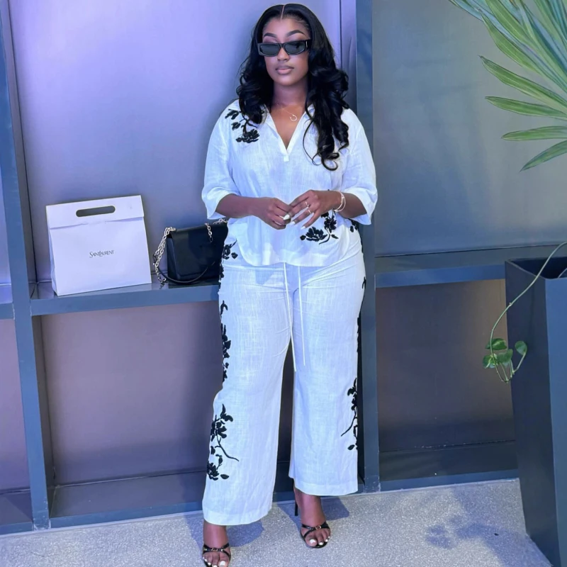 Neue Afrikanische Mode 2026 Blumenbedrucktes Damen-Set Halbarm-Bluse und Weite Hose Zweiteiler Urlaubs-Outfit