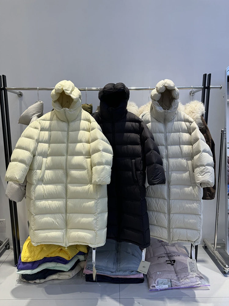 Korean style hooded knee length down jacket women in 2025 new loose and warm fashion solid white duck down bread jacket