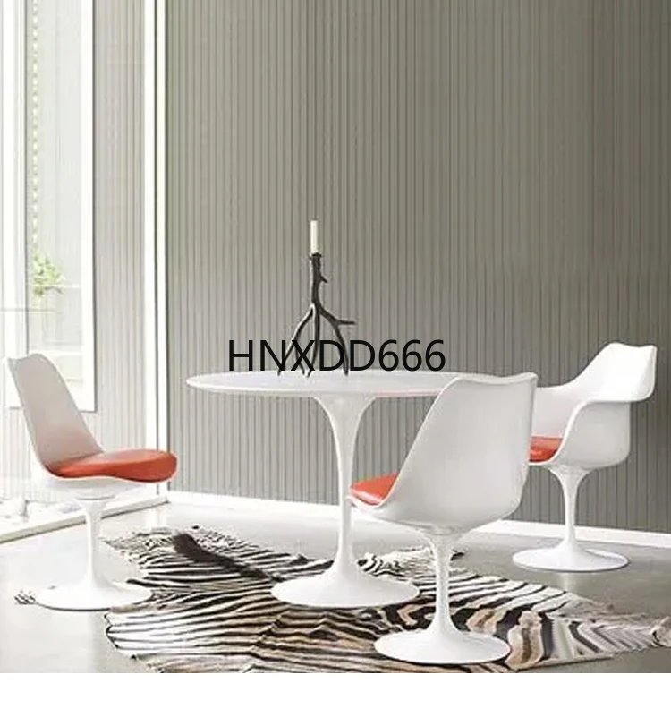 Rotating armchair dining table and chair combination