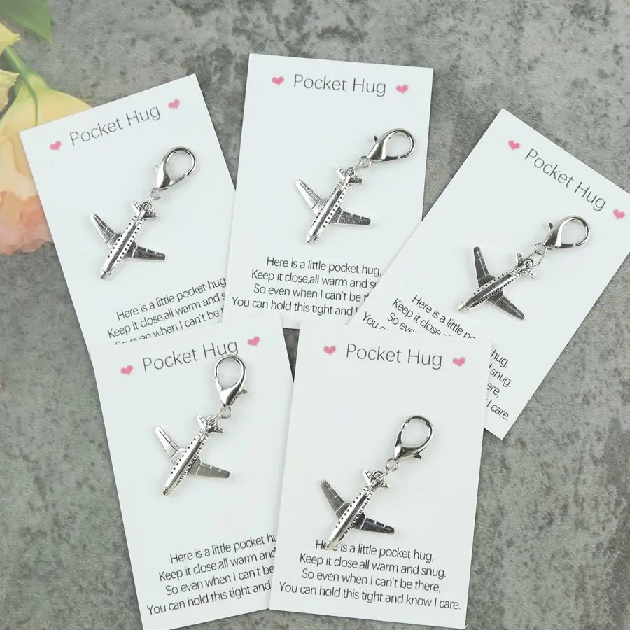 5pcs Silver Airplane Keychain with a Pocket-Sized Card Featuring a Heartfelt Message. Perfect as a Gift for Friends and Family.