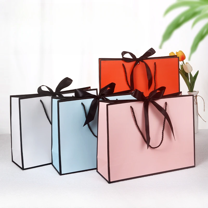 10pcs/lot High Quality Pretty Pink Gift Bag Gift Box Ornament Pajama Book Black Handle With Ribbon Paper Box Bag Kraft Packaging