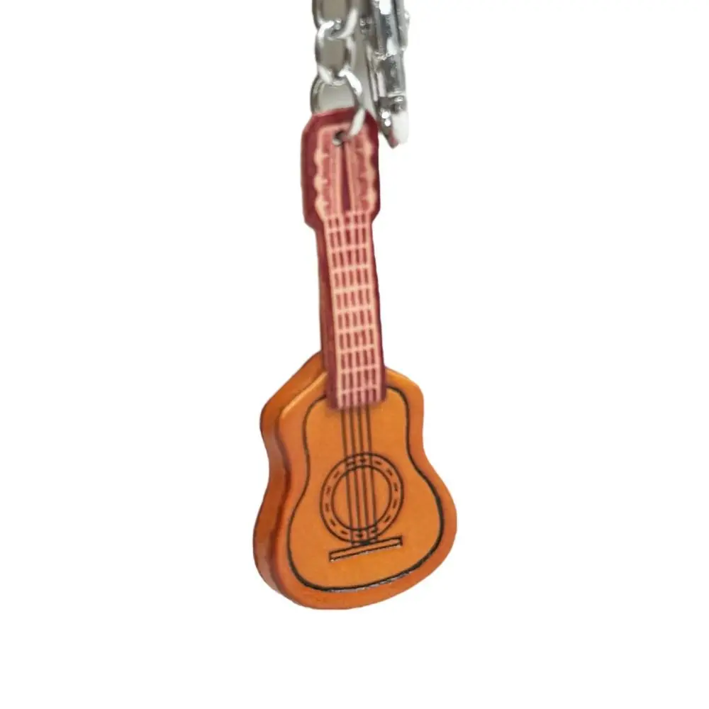 LLavero de guitarra clásica de cuero de vaca, guitarra española, llavero de guitarra clásica Vintage, colgante de instrumento Musical hecho a mano de cuero
