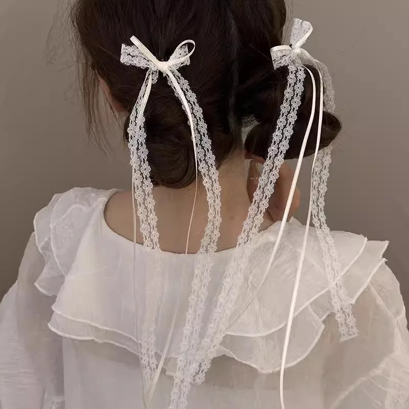 

2 шт. белые кружевные заколки для волос с длинными бантиками для женщин и девочек, ленточные бантики-кисточки, заколки-зажимы для кос, модные ажурные украшения для волос