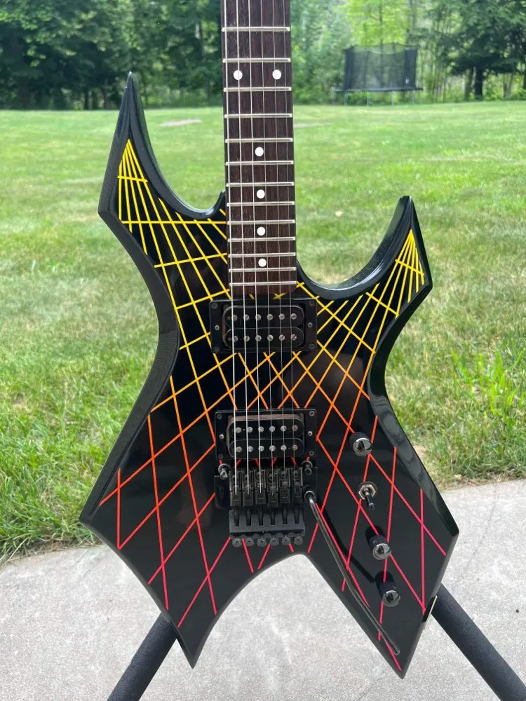 Electric guitar solid black with colorful lines on body top bevel neck thru rosewood fingerboard rock tremolo own logo 24 frets