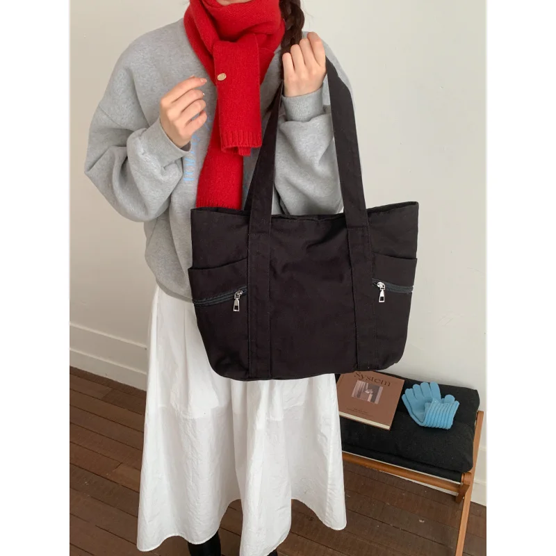 

2025New color canvas tote bag, large capacity, casual and versatile shoulder bag, fashionable large bag, commuter bag, solid col