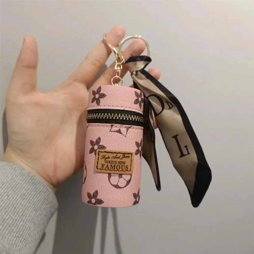 Bolsa cilíndrica mini para láp - Monogram Keychain Leather reseña y precio
