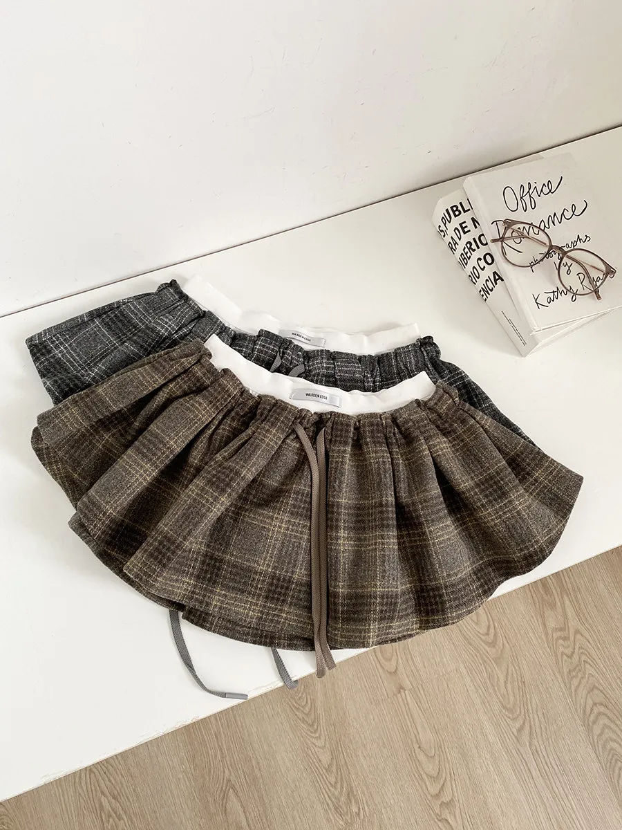 

Женская короткая юбка А-силуэта на весну-осень с завязками на талии, в стиле стритвир, с контрастным клетчатым узором