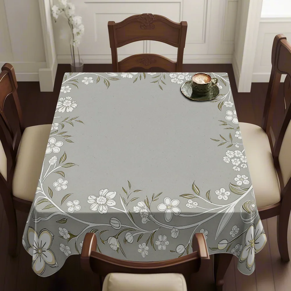 One light grey tablecloth with a white floral vine border pattern, yzb