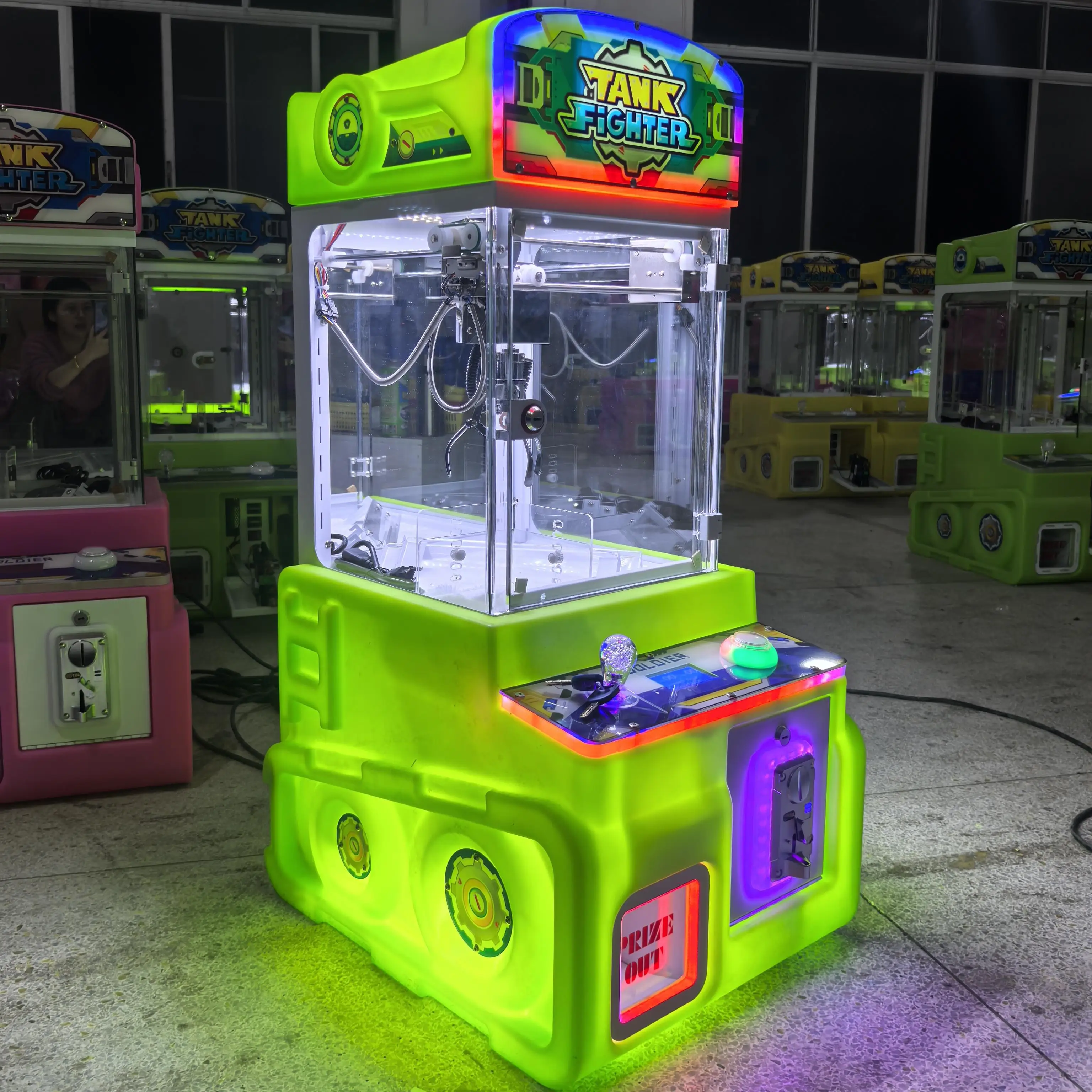 

Small plastic coin operated commercial candy machine, single doll capture, household crane
