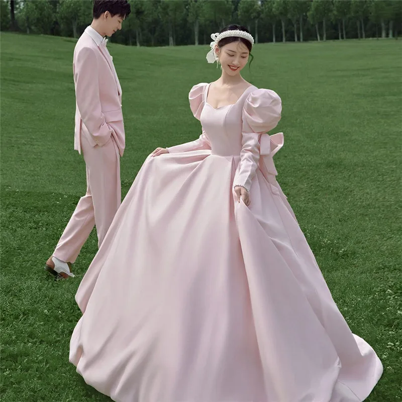 

Pink Bowknot Satin Outdoor Wedding Dress with Train And Bubble Sleeves for Couples Photo Shooting in Studio Forest System