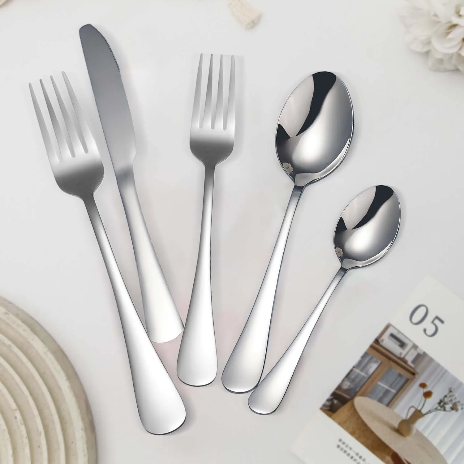 

Exquisite stainless steel tableware, including knives, forks, spoons, and commercial utensils, used for family dinners