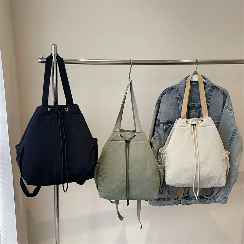 Bolsos De hombro sencillos De nailon De gran capacidad, novedad De 2025, Mochila De moda De Color sólido De alta calidad para ir al trabajo, Bolso De Hombro