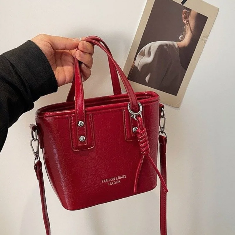 

Popular Women Handbag In Leather With Crossbody Strap By Luxury Brand Featuring Chic And Versatile Look