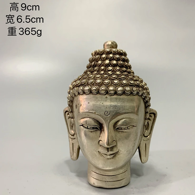 

Bronze collection white Buddha head home decoration to worship Buddha.