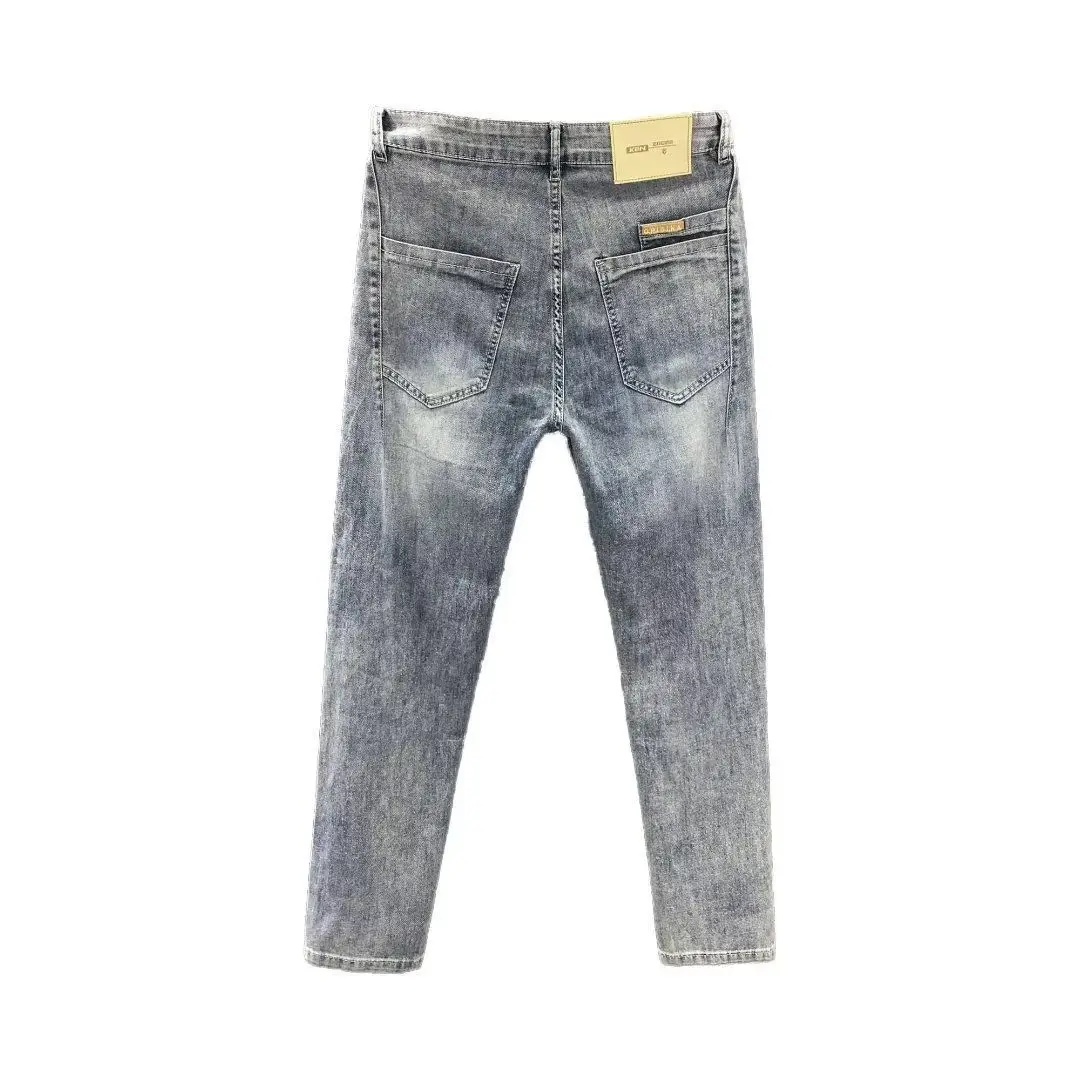 Nowe designerskie luksusowe jeansy dla mężczyzn Slim Fit moda wiosna jesień casualowe spodnie jeansowe długie spodnie sprane Streetwear Jeans Man