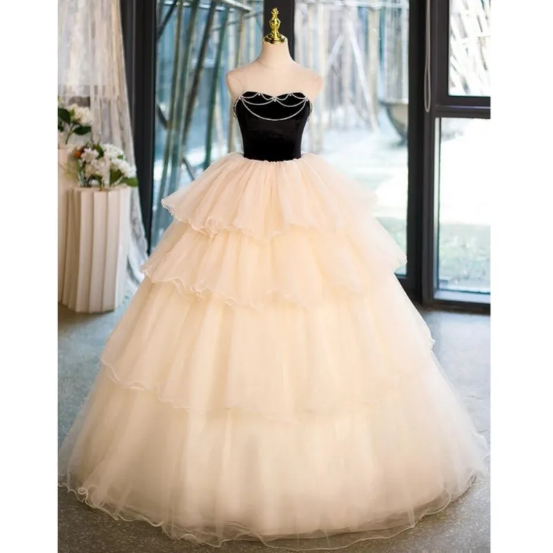 

Elegant Champagne Quinceanera Dresses Illusion O-neck Fashion Tiered Ball Gowns Sleeveless Long Simple Robe De Bal Custom Made