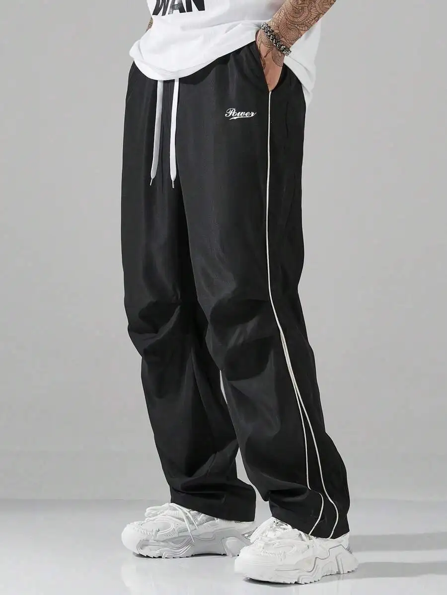 

Men's Black Loose Fit Drawstring Waist Pants with Side Stripe and Embroidered Script