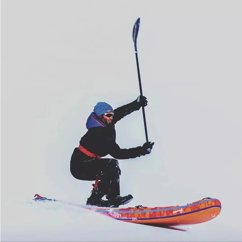 Standing up in the cold winter to paddle on the snow, snowboards, snowboards for sale
