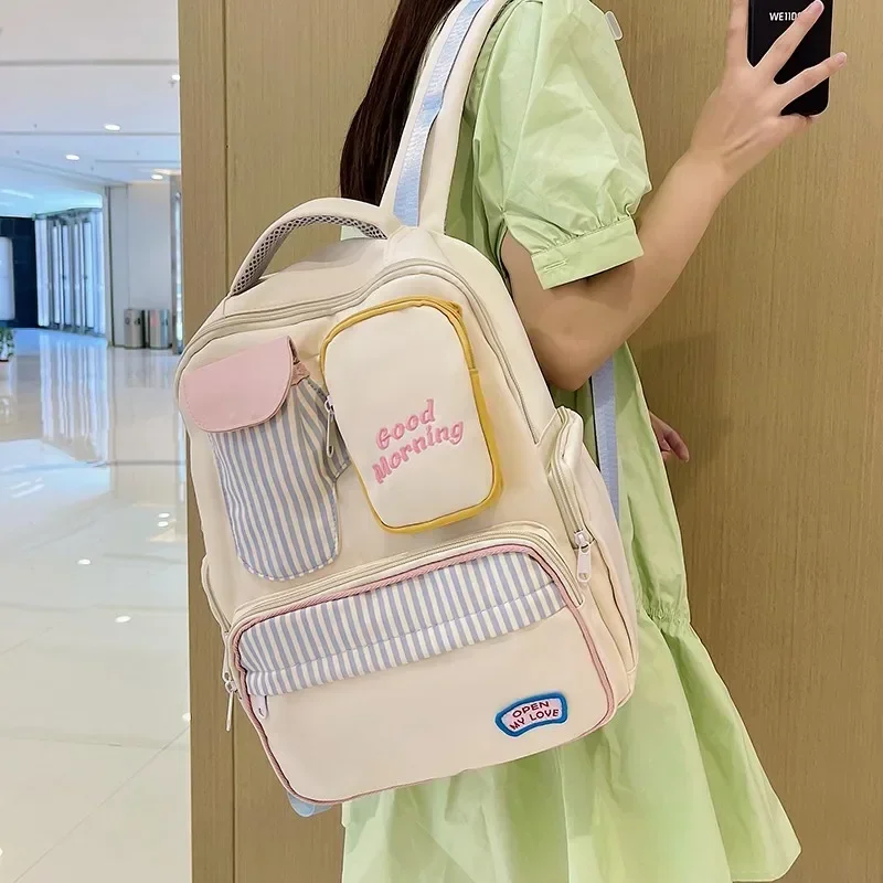 Female Bags on Sale 2024 High Quality Fashionable and Large Capacity Backpack Canvas Letter Patchwork Zipper Backpacks 여성용 가방