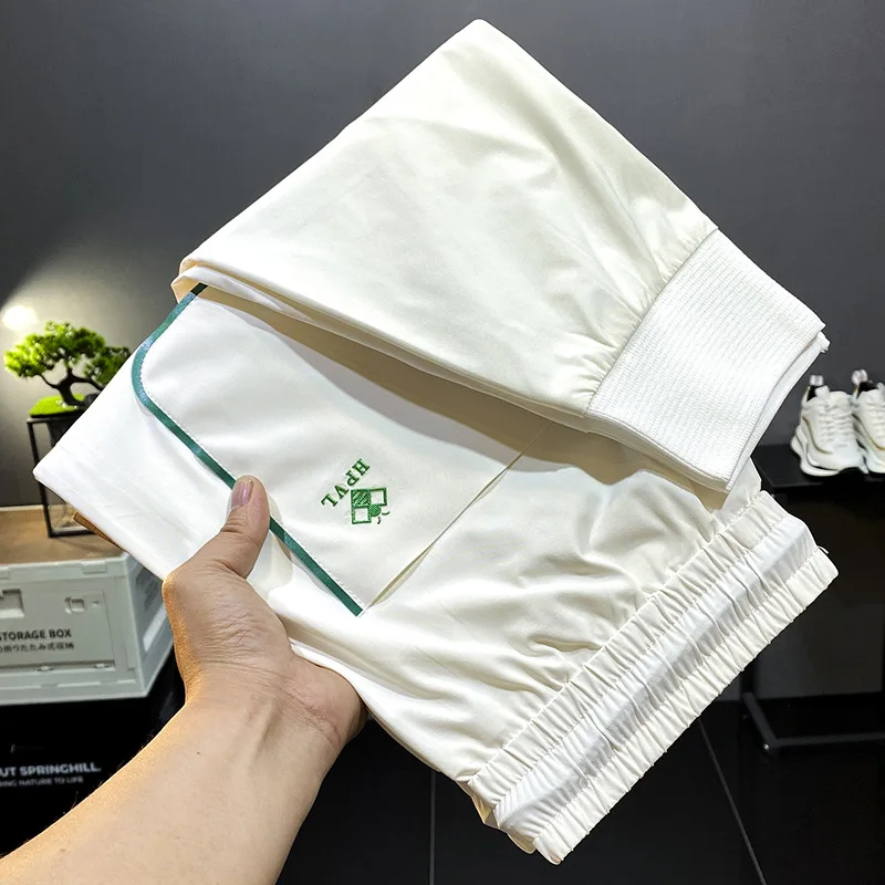 Summer high end light luxury thin silky soft fashion slim fit tie feet large black ice silk elastic sports MEN'S casual pants