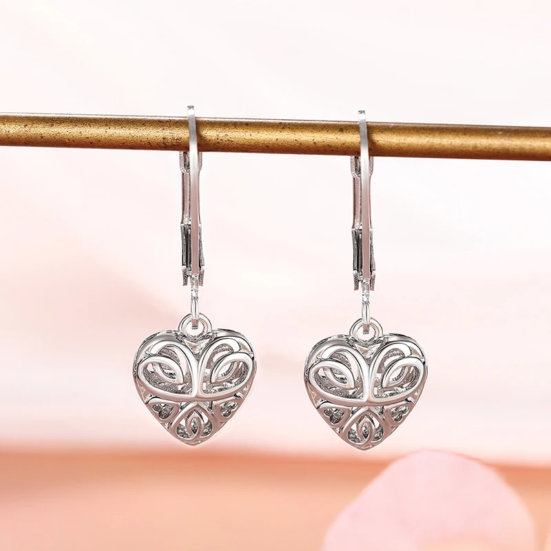 Huitan Mode hohl Herz Anhänger Tropfen Ohrringe für Frauen einfache stilvolle Design Silber Farbe Temperament elegante Liebe Schmuck