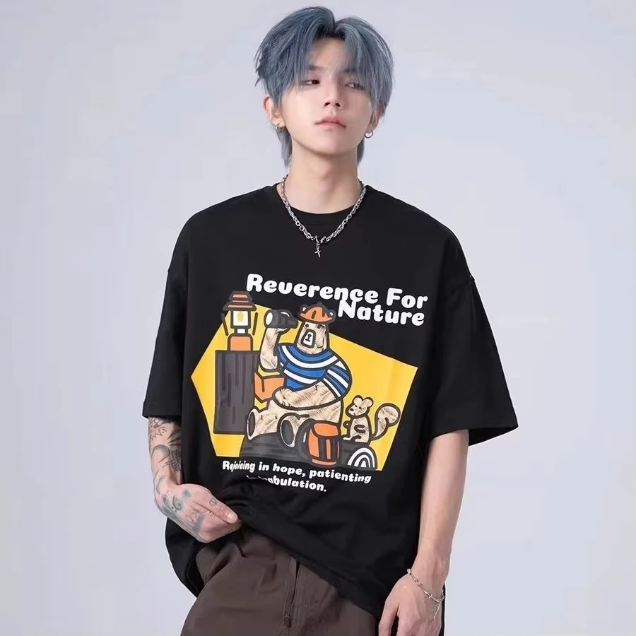

Premium Black Graphic Tee Cartoon Bear with Striped Shirt and Mouse Companion Featuring Reverence for Nature Slogan