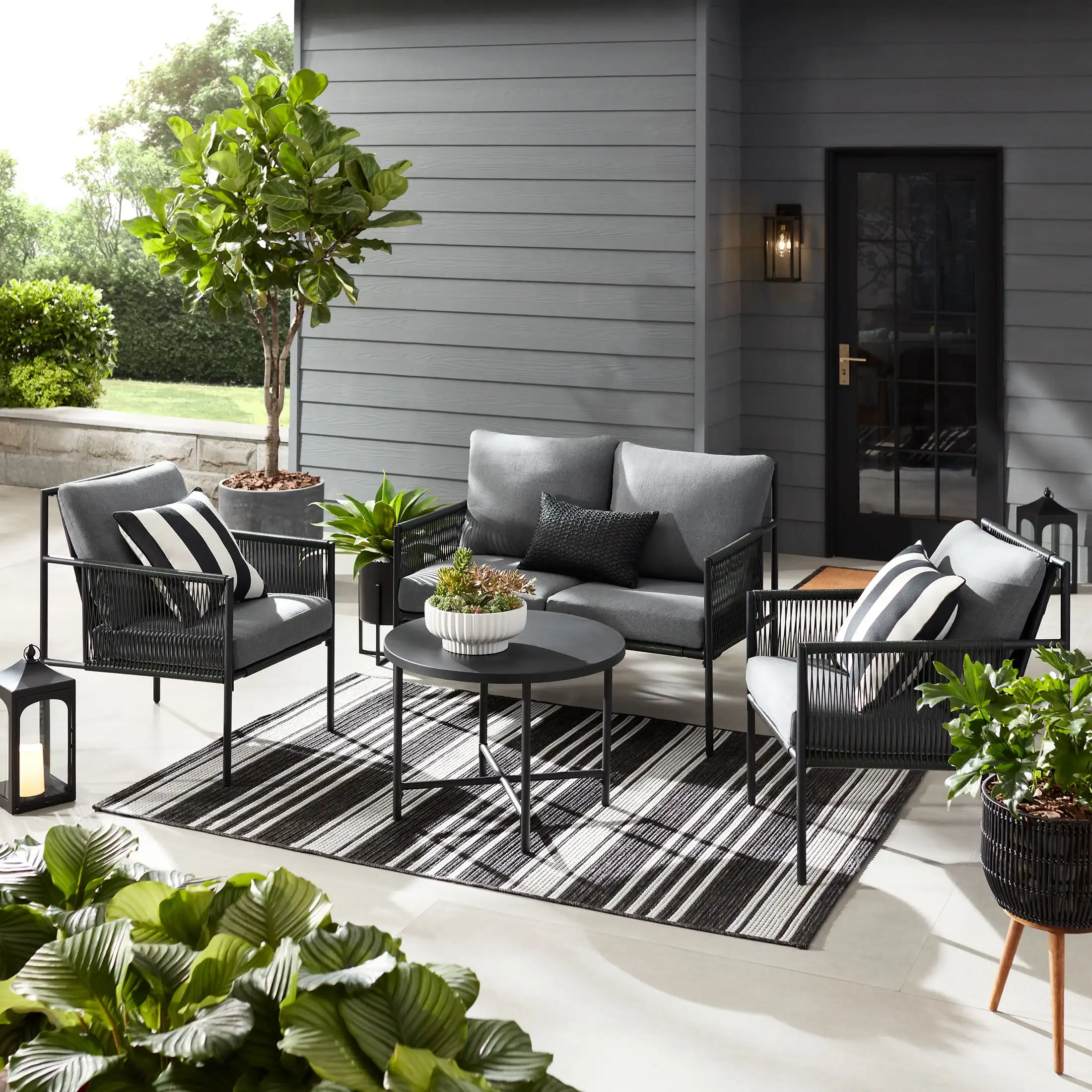 Logan 4-Piece Outdoor Conversation Set Dark Gray Steel Polyethylene Wicker Olefin Fabric Polyester Fiber Batting