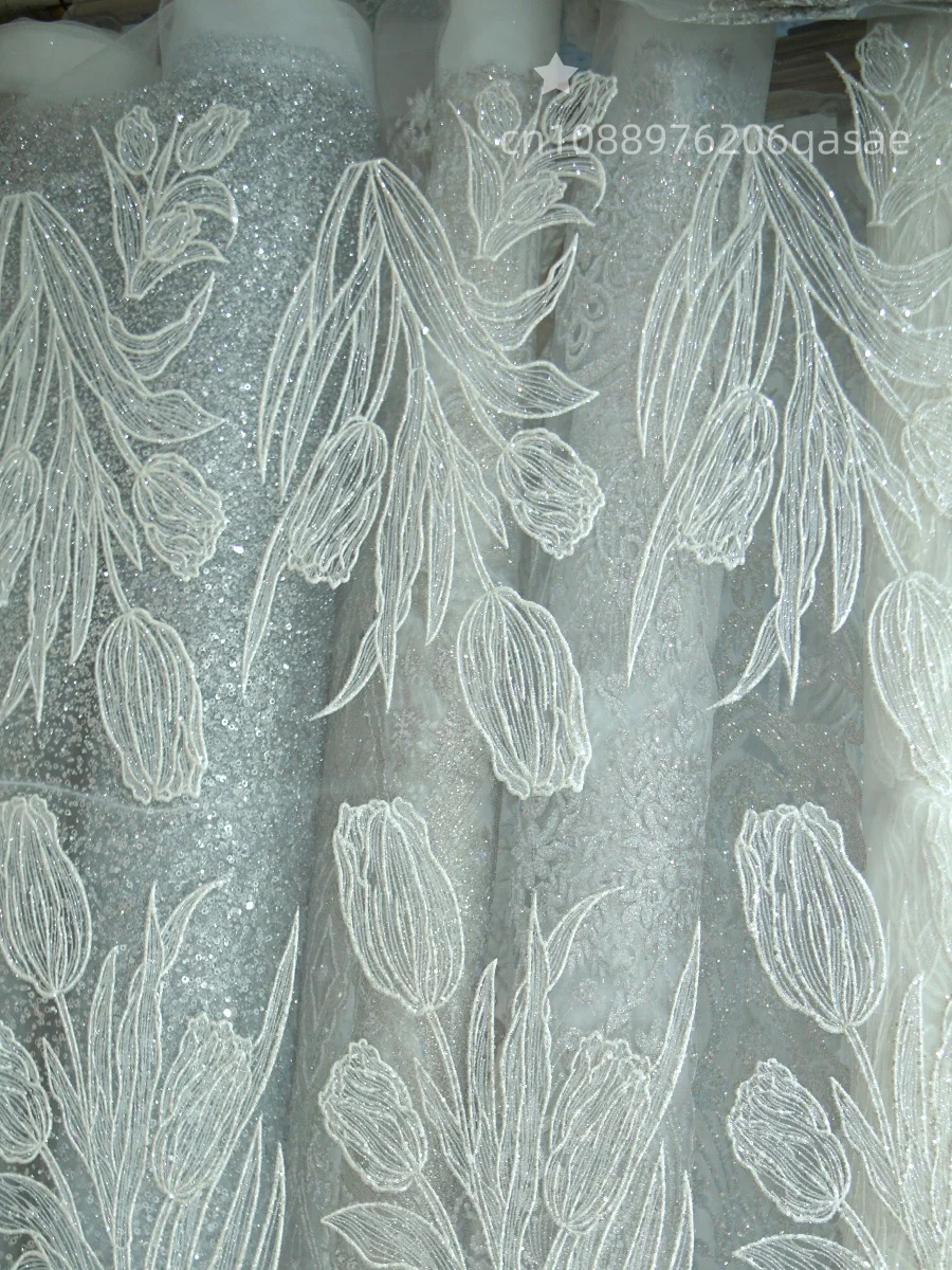 

Thin tulip-shaped flowers with silver-golden glittering embroidery net fabric suitable for wedding dresses and formal gowns