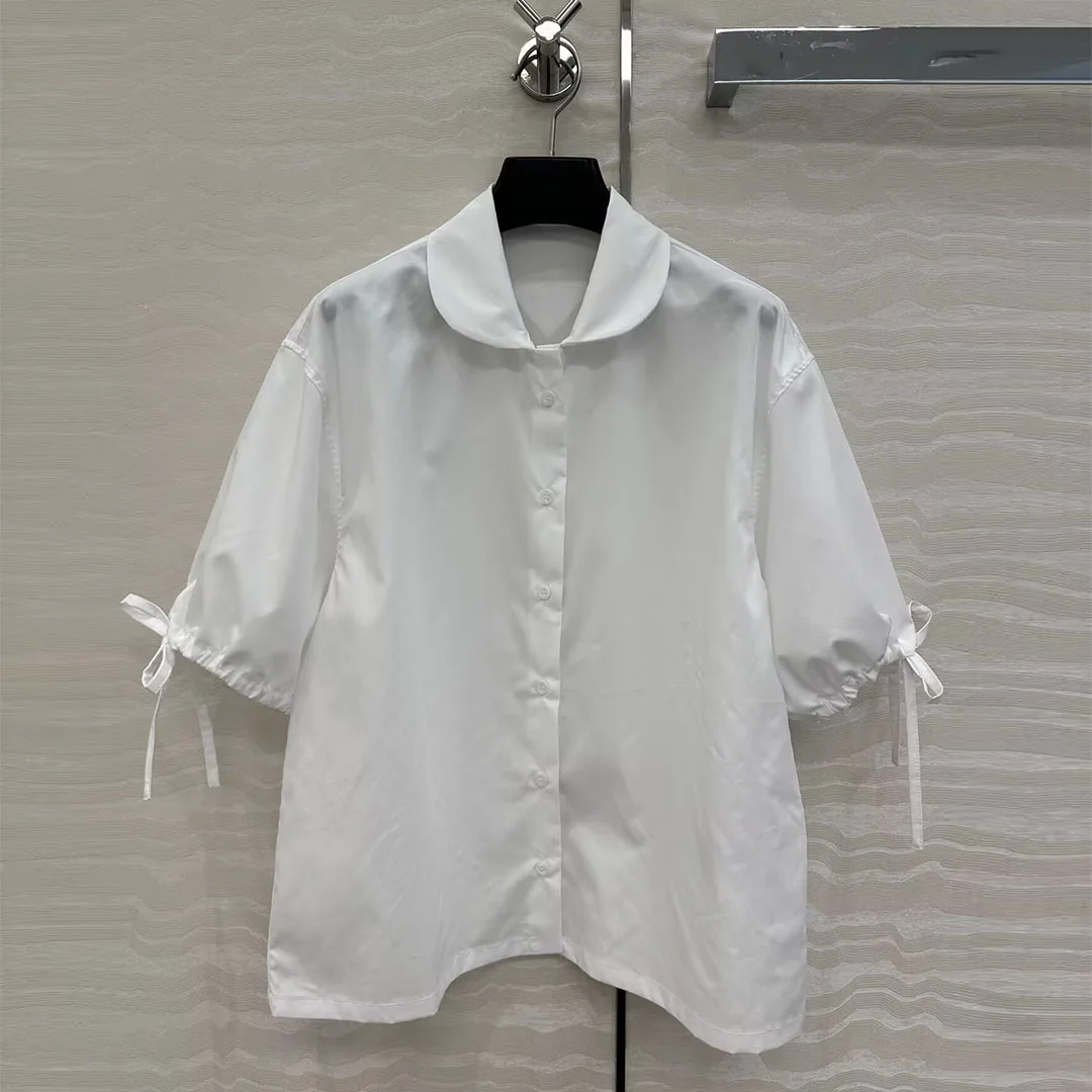

Новинка 2023 года в консервативном стиле, летняя белая хлопковая свободная рубашка, женская милая однобортная блузка с воротником Питера Пэна на шнуровке и короткими рукавами
