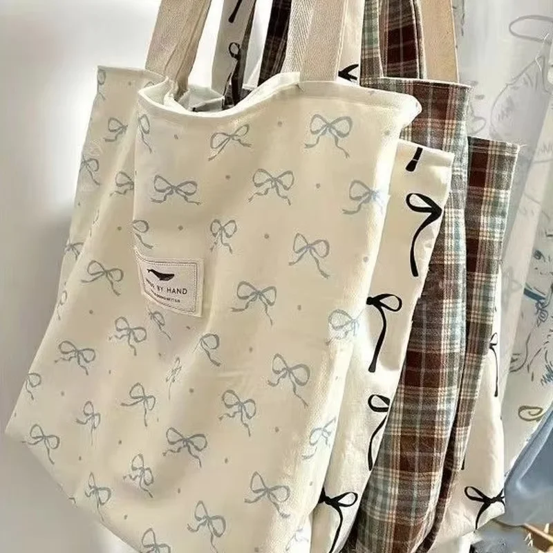 حقيبة كتف جديدة للطالبات النسخة الكورية، حقيبة حمل ذات سعة كبيرة للتنقل، حقيبة يد ربطة القوس فيونكة، حقيبة تسوق