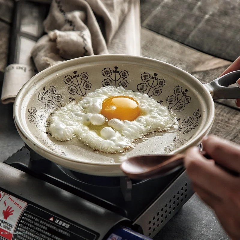Minimally Designed Ceramic Flat Bottomed Clay Pot That Can Be Used with an Open Flame and a Frying Pan with a Handle