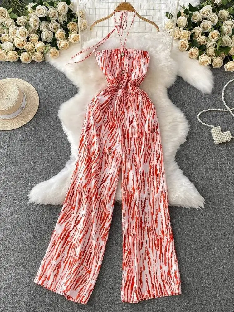 夏のセクシーなジャンプスーツ女性プリント胸ラップぶら下げネックストリートジャンプスーツ女性ストレートレッグワイドレッグパンツロンパース