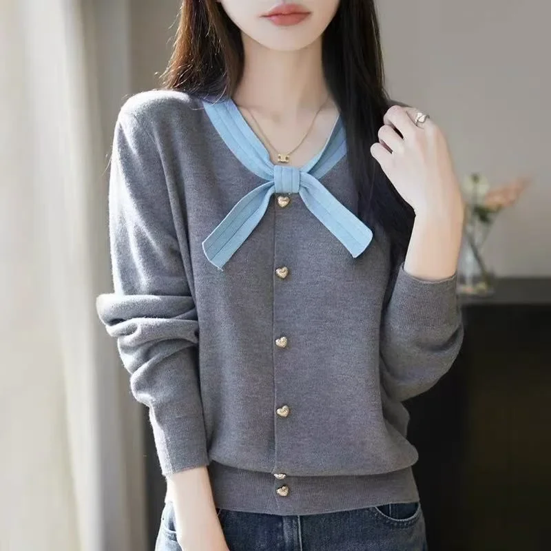 2025 sensación avanzada Top prendas de vestir exteriores delicado nudo de mariposa francesa bloque de Color alta simulación de punto chaqueta de mujer suéter nuevo