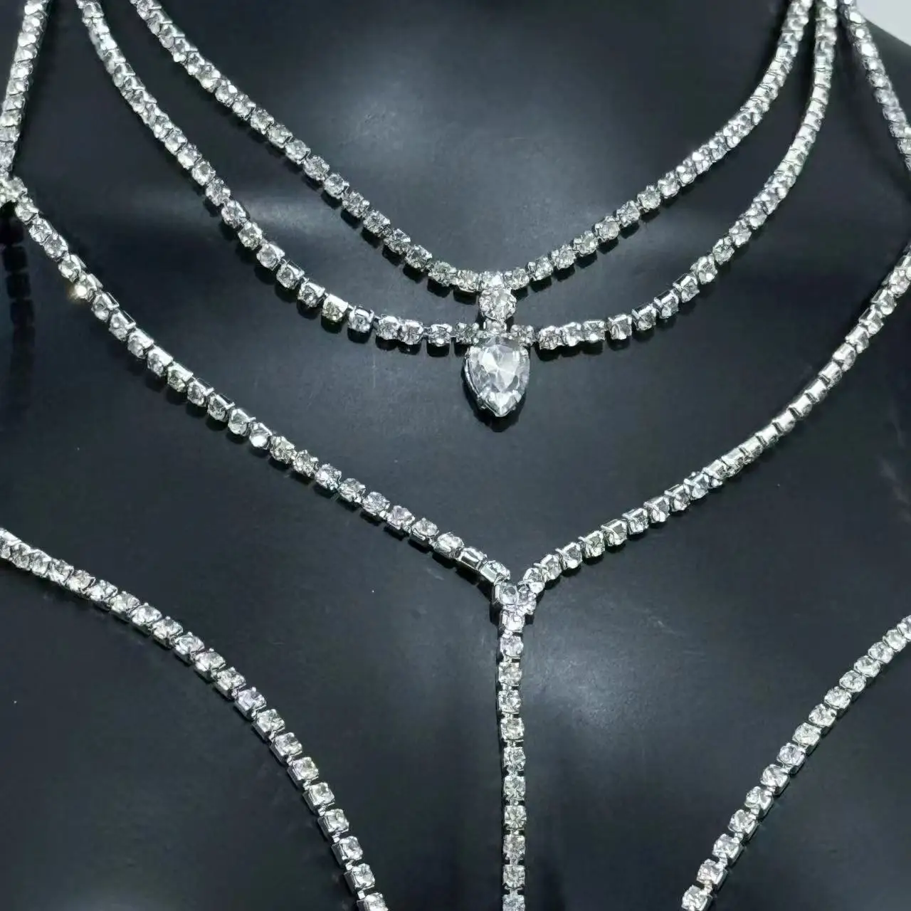 Fashionable, sexy, and sparkling with full rhinestones, this fringe chest chain features a personalized design, serving as a bod
